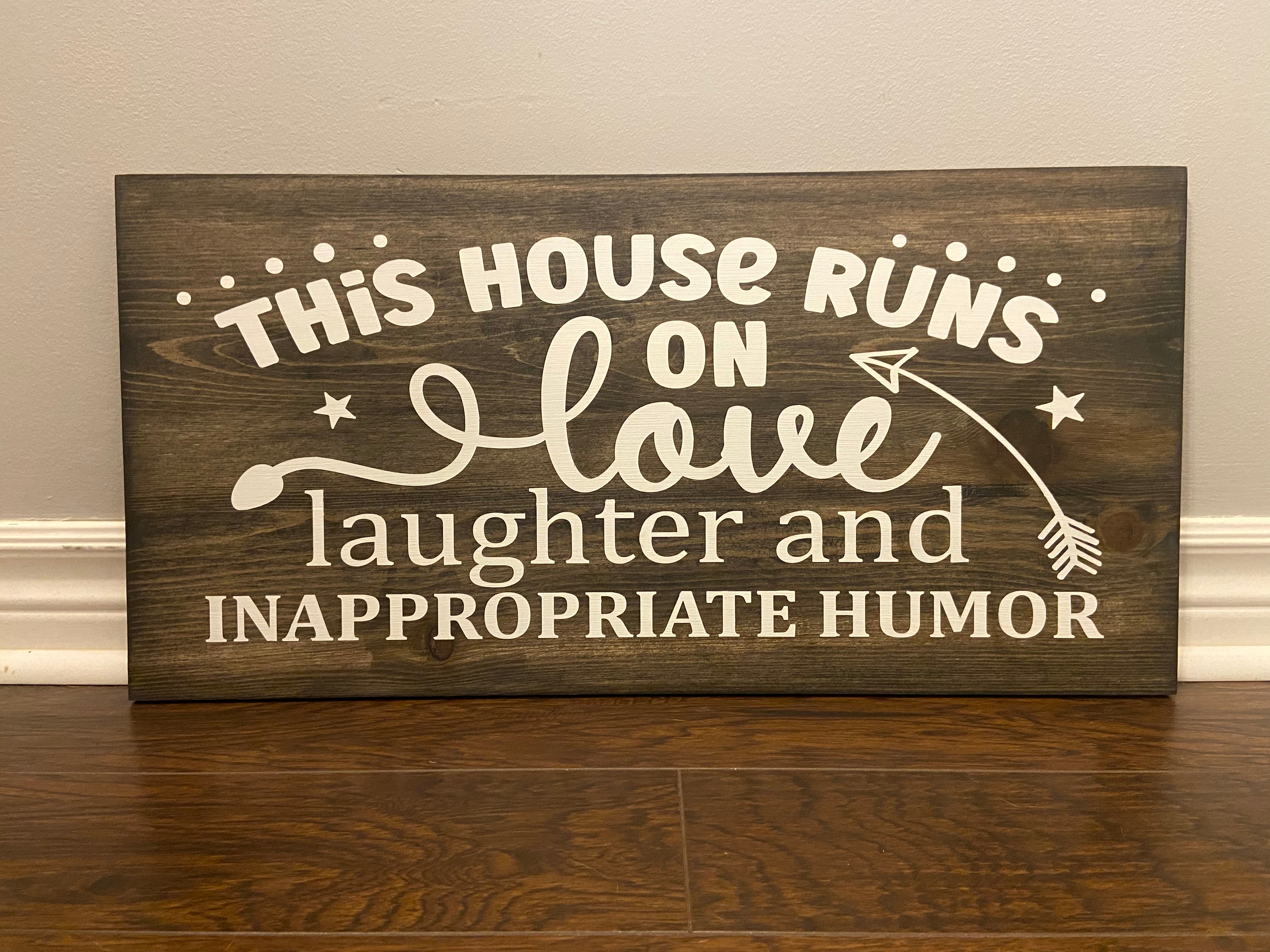 “This house runs on” Sign